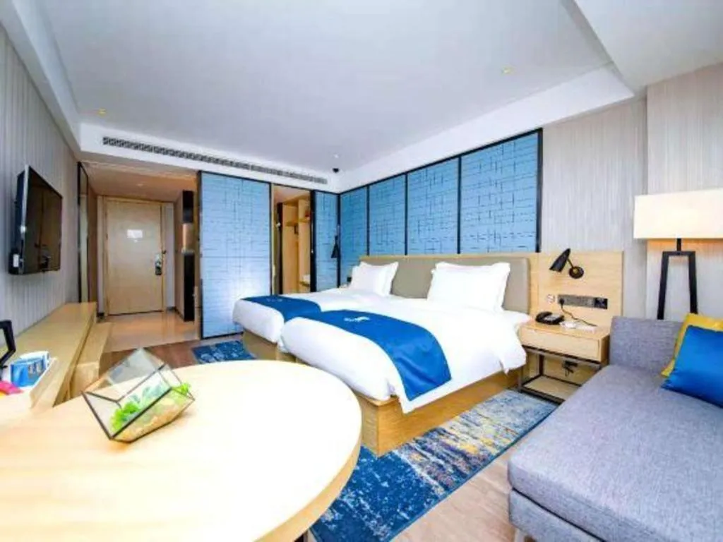 Bed in Echarm Hotel Xiantao Yuantai Weilaicheng