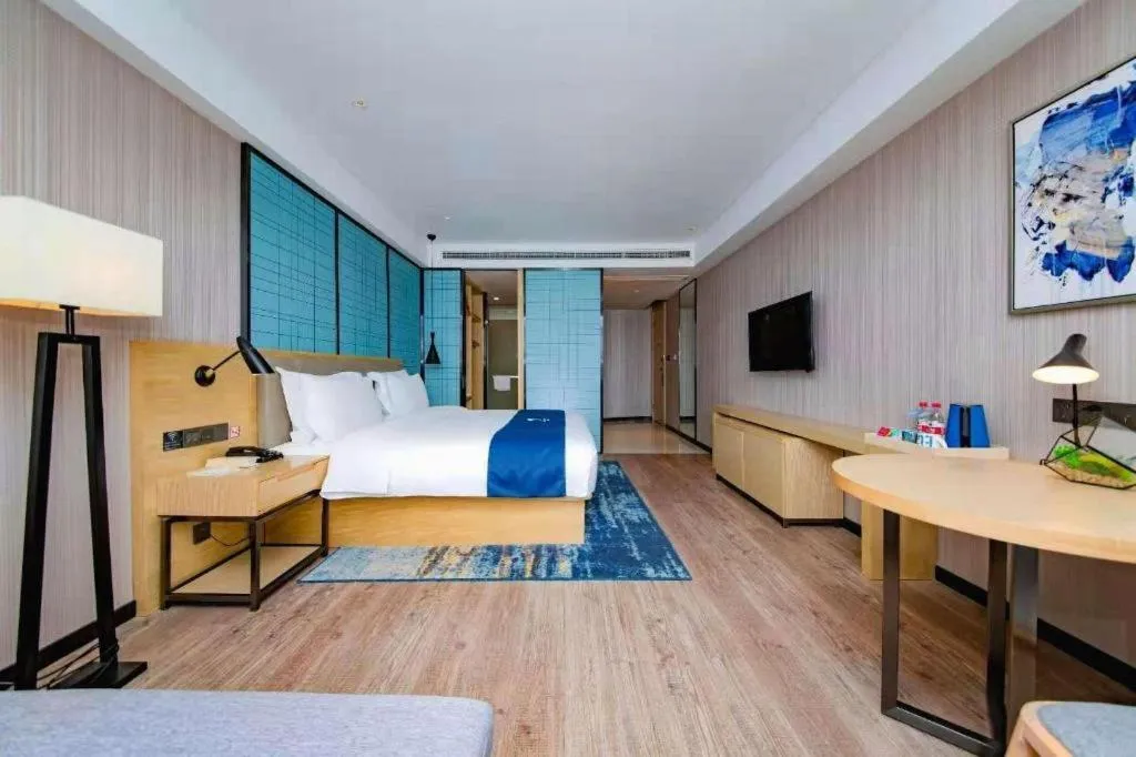 Bed in Echarm Hotel Xiantao Yuantai Weilaicheng