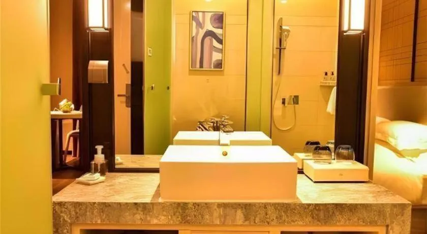 Bed in Echarm Hotel Xiantao Yuantai Weilaicheng