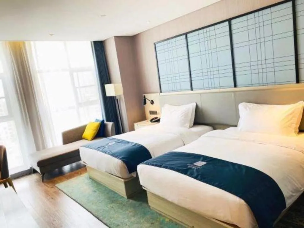 Bed in Echarm Hotel Xiantao Yuantai Weilaicheng