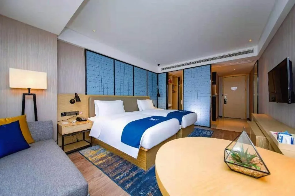 Bed in Echarm Hotel Xiantao Yuantai Weilaicheng