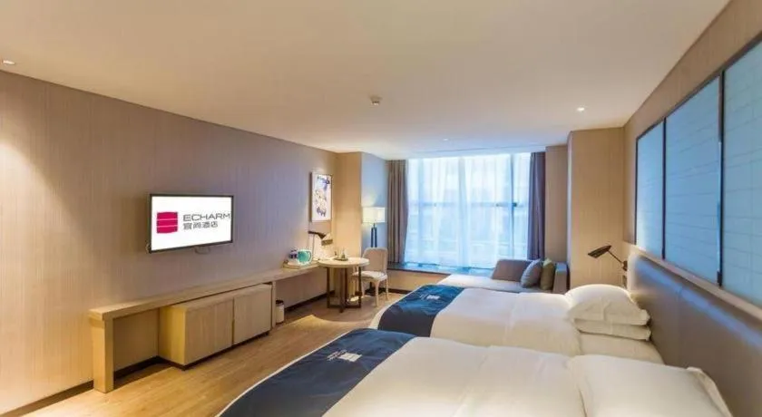 Bed in Echarm Hotel Xiantao Yuantai Weilaicheng