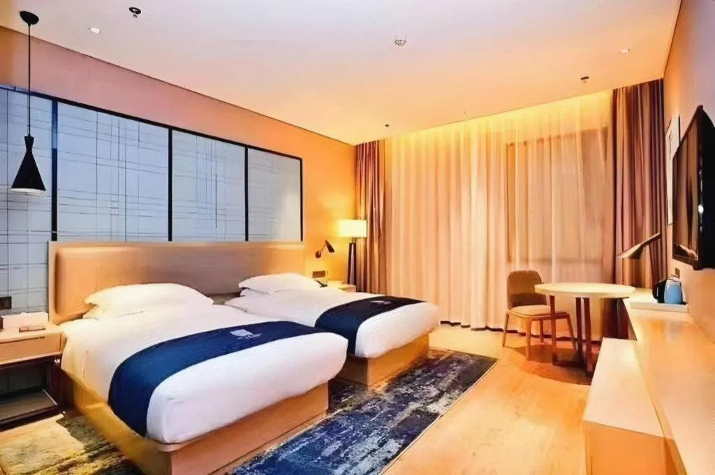 Bed in Echarm Hotel Xiantao Yuantai Weilaicheng