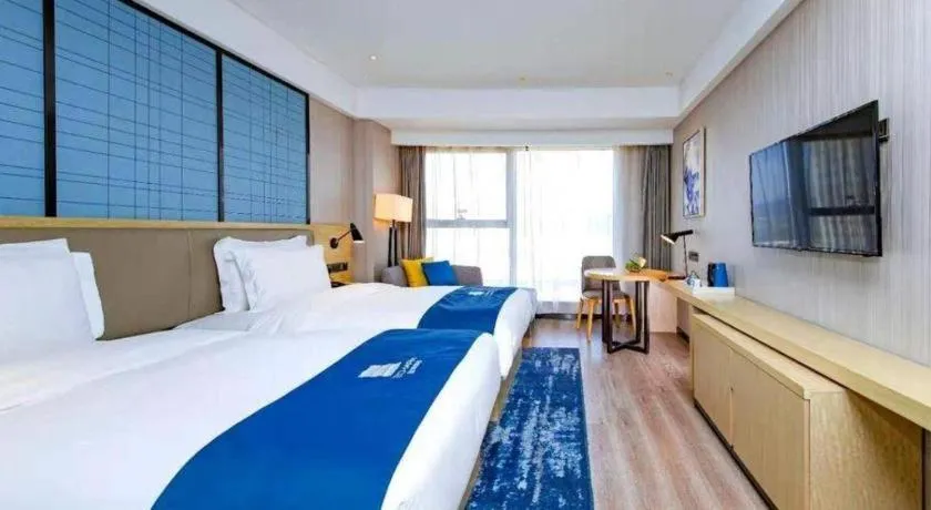 Bed in Echarm Hotel Xiantao Yuantai Weilaicheng