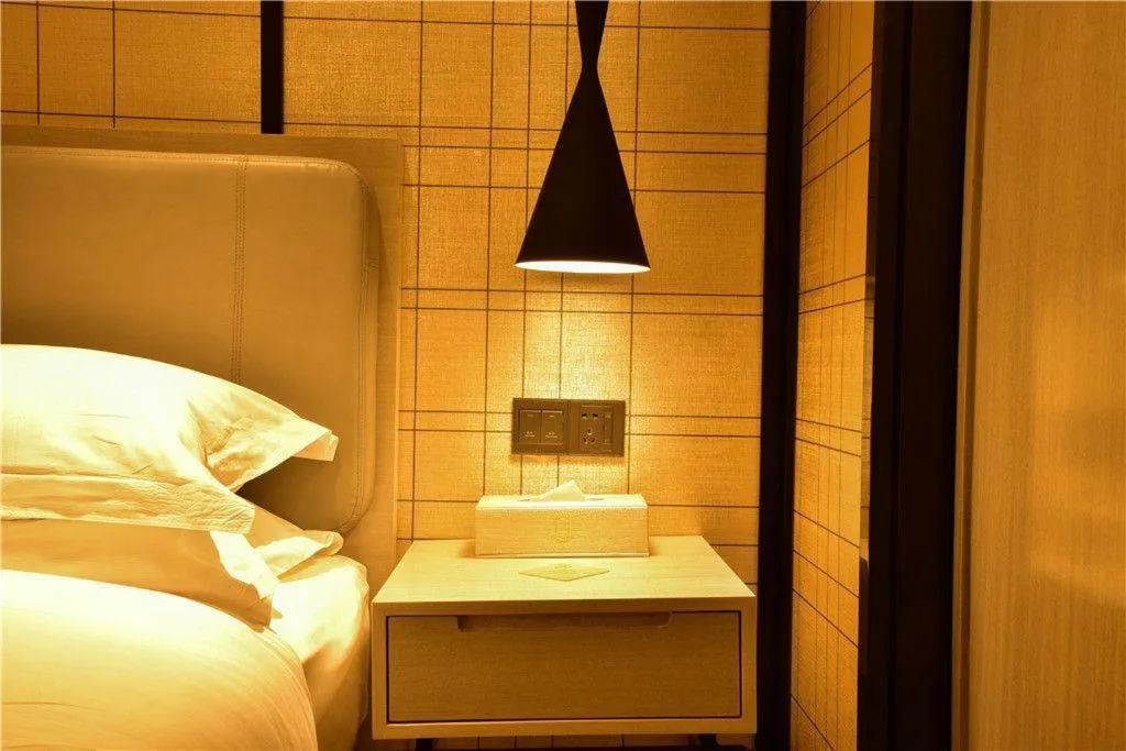 Bed in Echarm Hotel Xiantao Yuantai Weilaicheng
