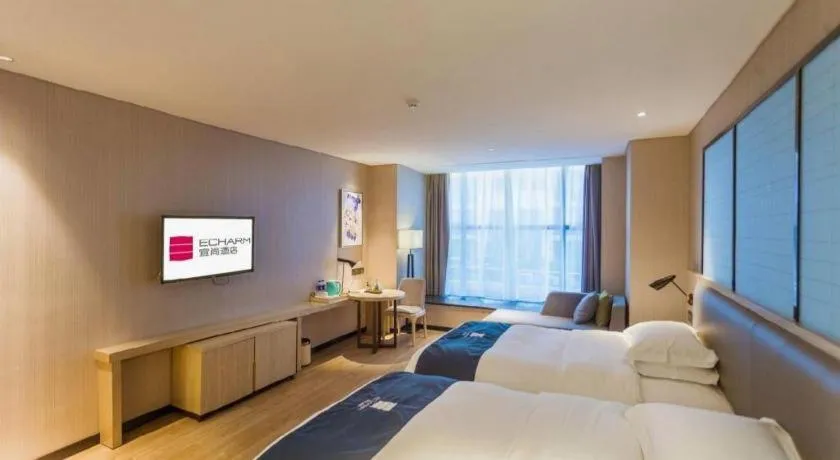 Bed in Echarm Hotel Xiantao Yuantai Weilaicheng