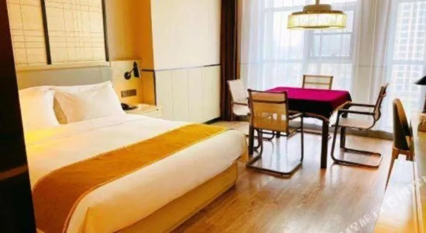 Bed in Echarm Hotel Xiantao Yuantai Weilaicheng