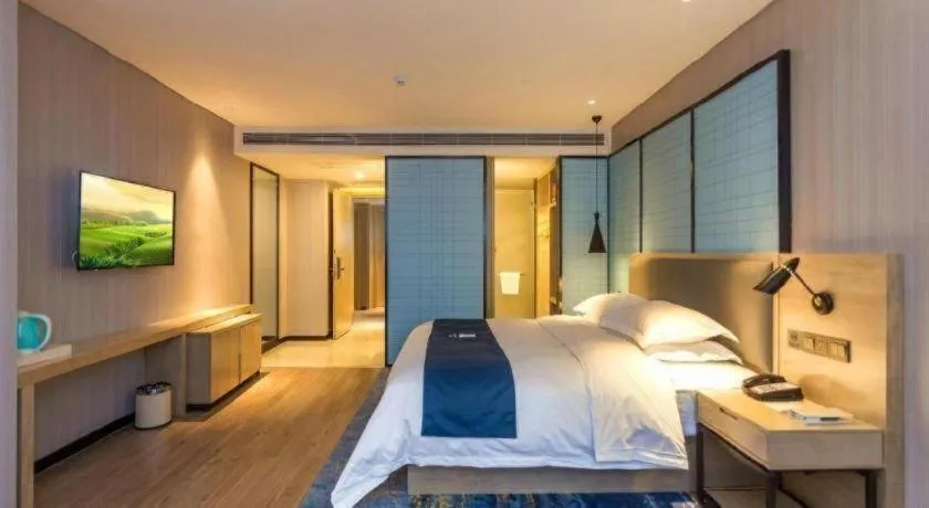 Bed in Echarm Hotel Xiantao Yuantai Weilaicheng