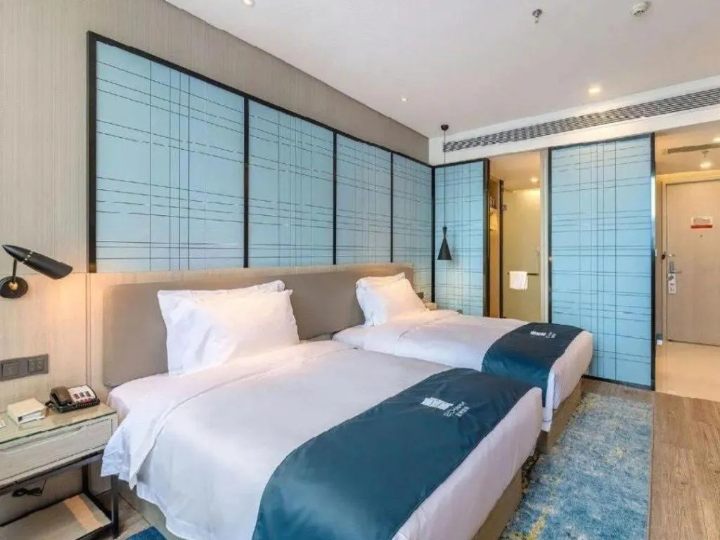 Bed in Echarm Hotel Hefei Binhu Exhibition Center