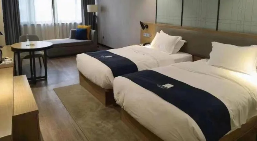 Bed in Echarm Hotel Hefei Binhu Exhibition Center