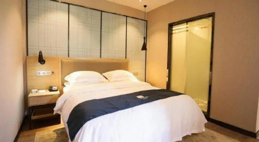 Bed in Echarm Hotel Hefei Binhu Exhibition Center