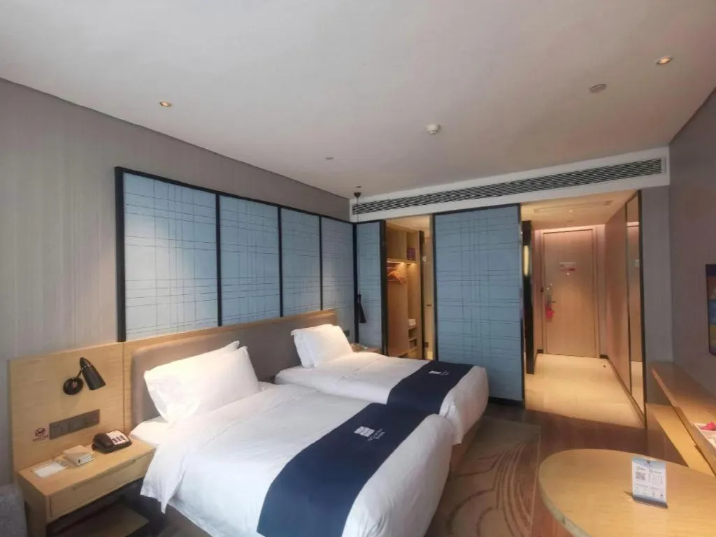 Bed in Echarm Hotel Hefei Binhu Exhibition Center