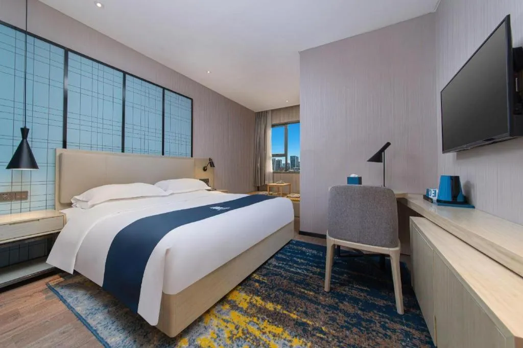 Bed in Echarm Hotel Hefei Binhu Exhibition Center