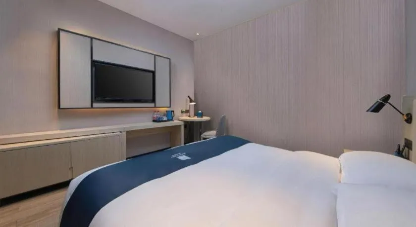 Bed in Echarm Hotel Hefei Binhu Exhibition Center