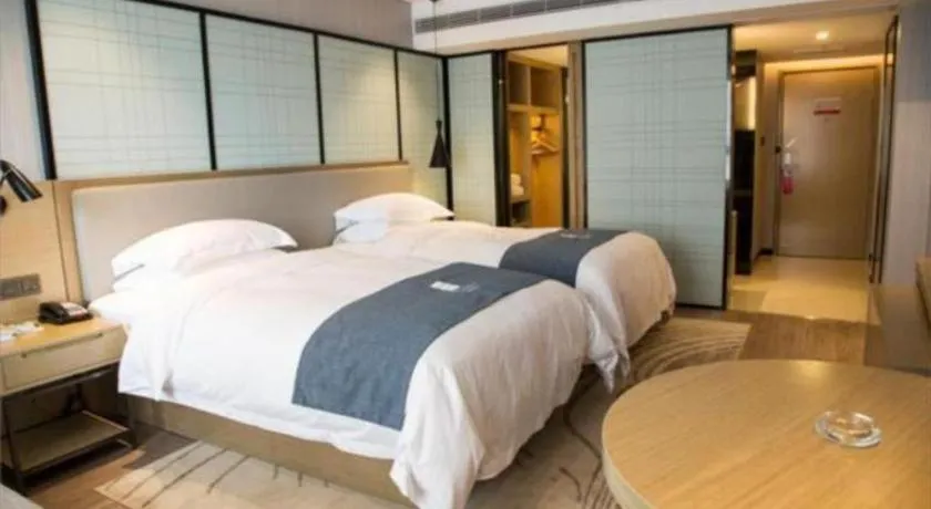 Bed in Echarm Hotel Hefei Binhu Exhibition Center