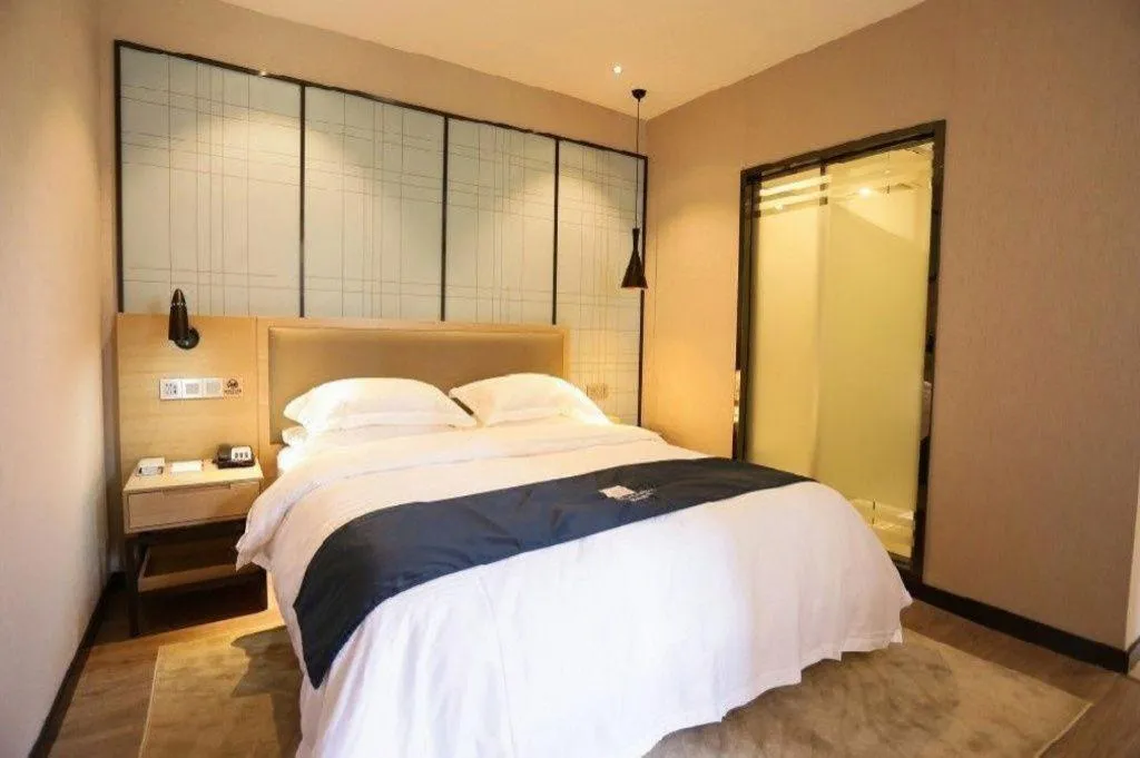 Bed in Echarm Hotel Hefei Binhu Exhibition Center