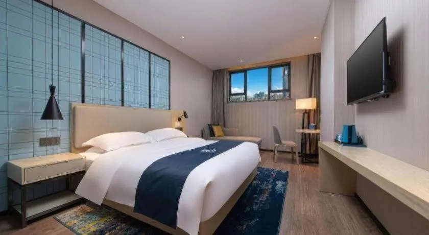 Bed in Echarm Hotel Hefei Binhu Exhibition Center