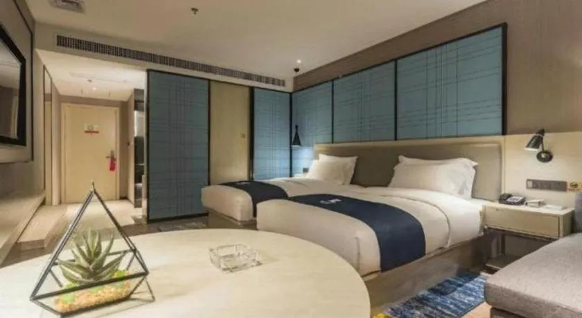 Bed in Echarm Hotel Hefei Binhu Exhibition Center