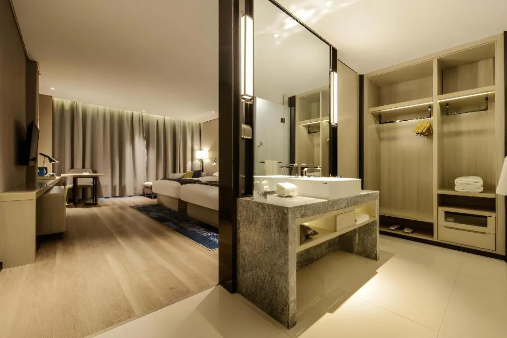 Bed in Echarm Hotel Guizhou Xingyi Jushan Avenue