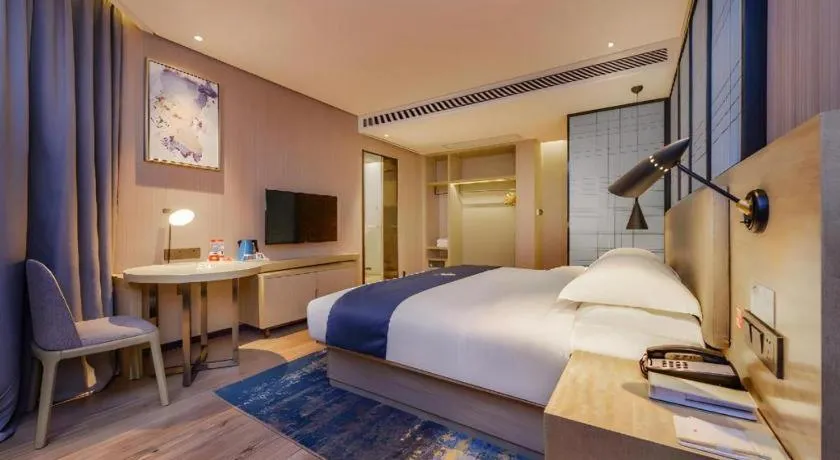 Bed in Echarm Hotel Guizhou Xingyi Jushan Avenue