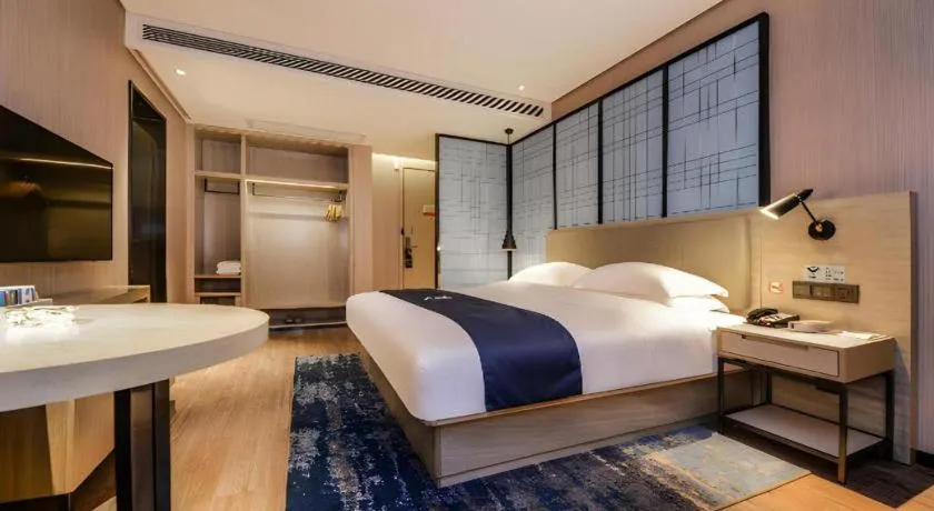Bed in Echarm Hotel Guizhou Xingyi Jushan Avenue