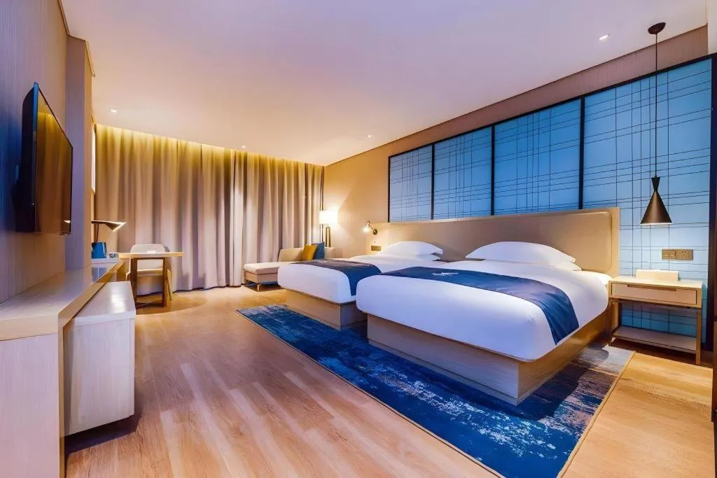 Bed in Echarm Hotel Guizhou Xingyi Jushan Avenue