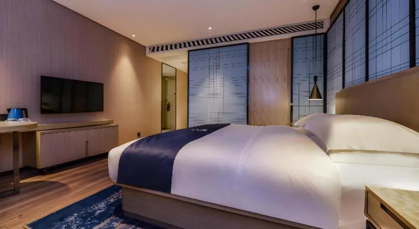 Bed in Echarm Hotel Guizhou Xingyi Jushan Avenue
