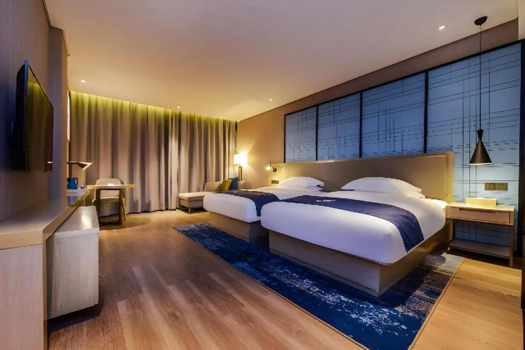 Bed in Echarm Hotel Guizhou Xingyi Jushan Avenue