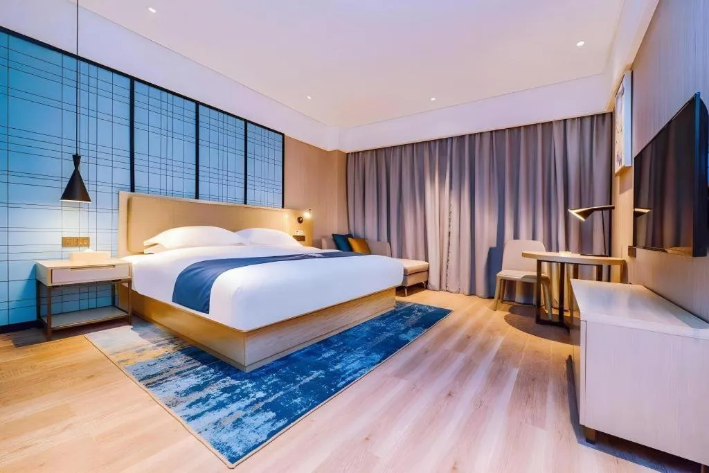 Bed in Echarm Hotel Guizhou Xingyi Jushan Avenue