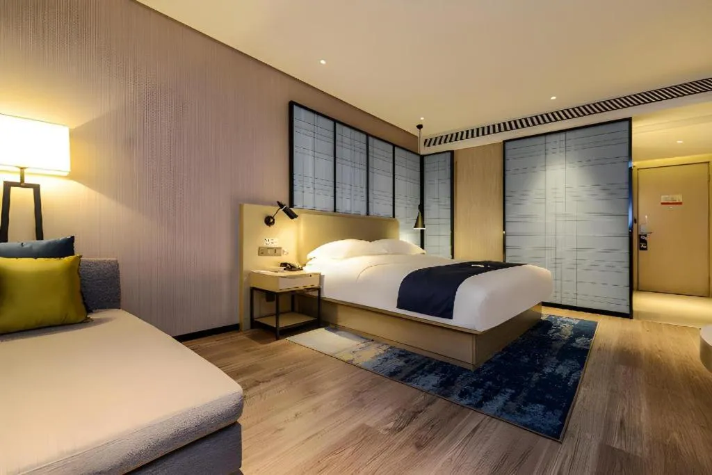 Bed in Echarm Hotel Guizhou Xingyi Jushan Avenue