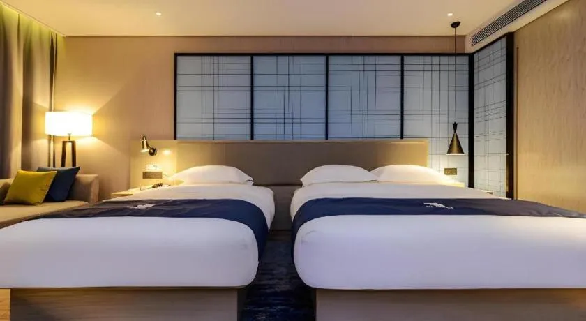 Bed in Echarm Hotel Guizhou Xingyi Jushan Avenue