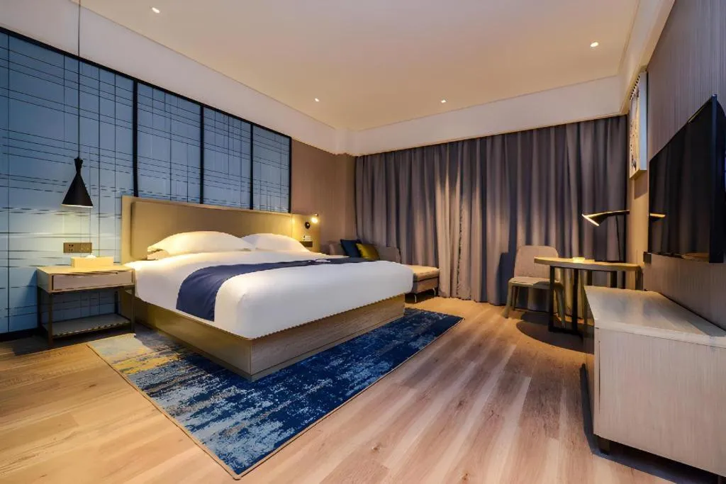 Bed in Echarm Hotel Guizhou Xingyi Jushan Avenue