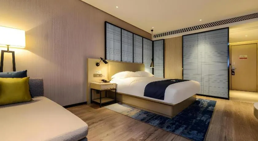 Bed in Echarm Hotel Guizhou Xingyi Jushan Avenue