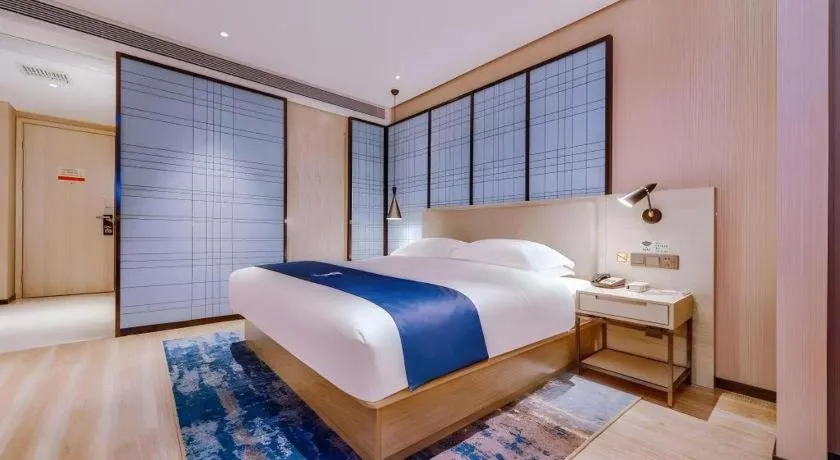 Bed in Echarm Hotel Guizhou Xingyi Jushan Avenue