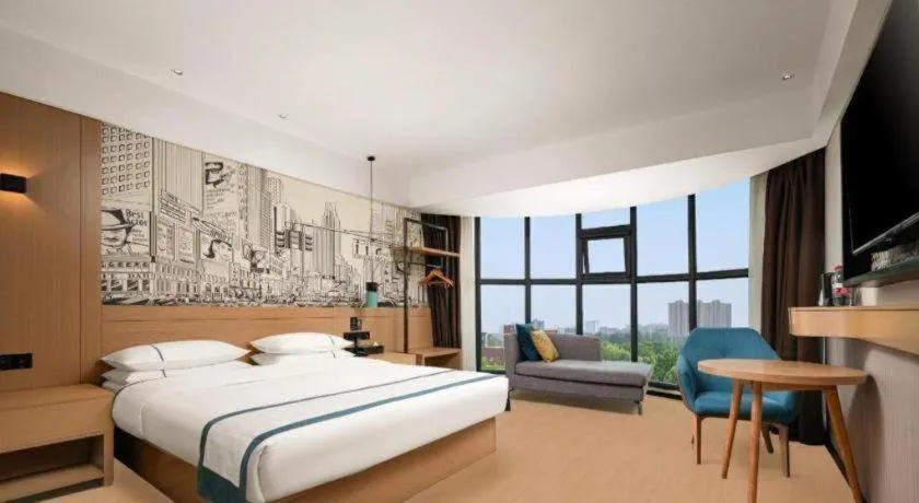 Bed in City Comfort Inn Yuzhou Yuwang Square