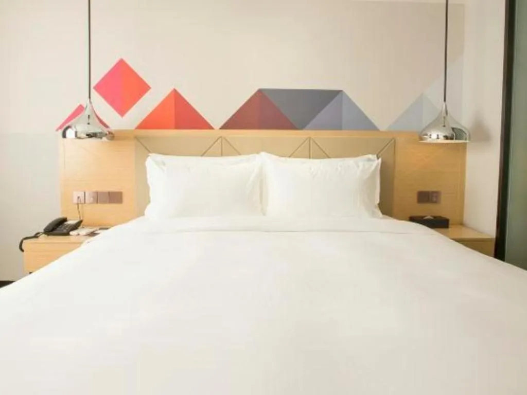 Bed in Borrman Hotel Zhuhai Gongbei Port Fuhuali Light Rail