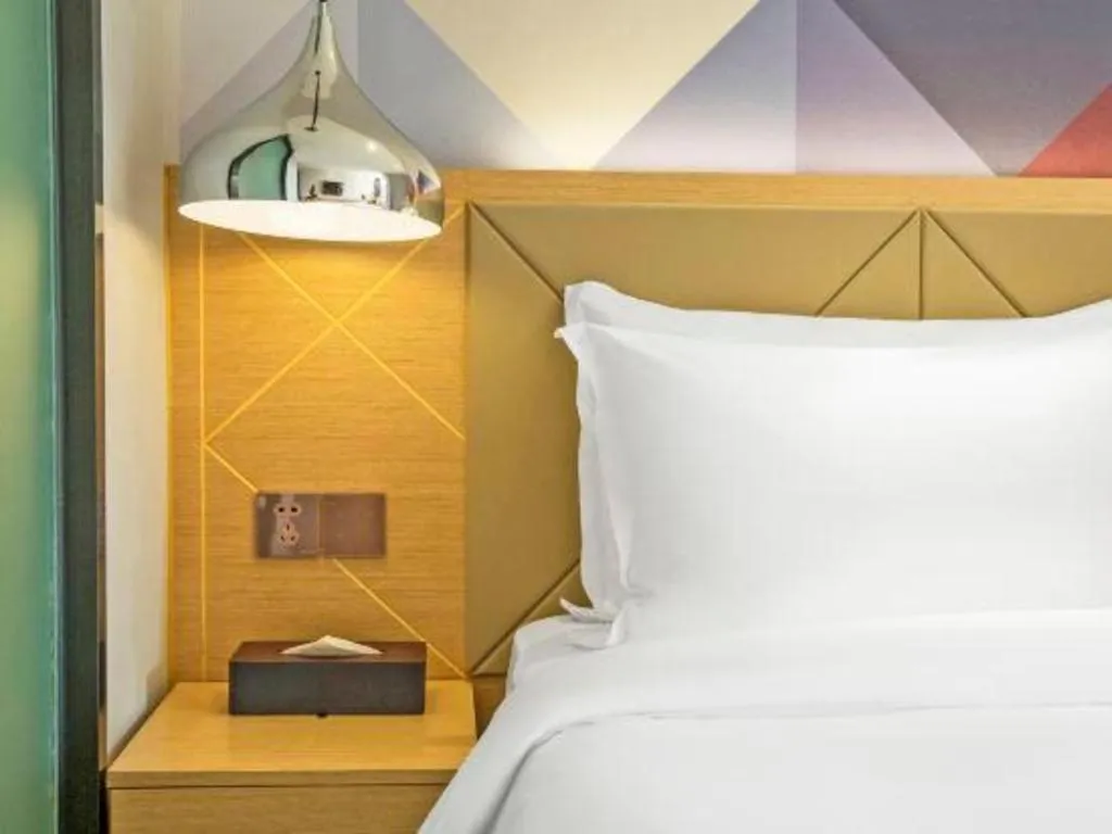 Bed in Borrman Hotel Zhuhai Gongbei Port Fuhuali Light Rail