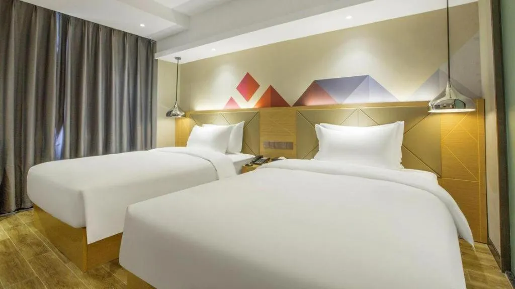 Bed in Borrman Hotel Zhuhai Gongbei Port Fuhuali Light Rail
