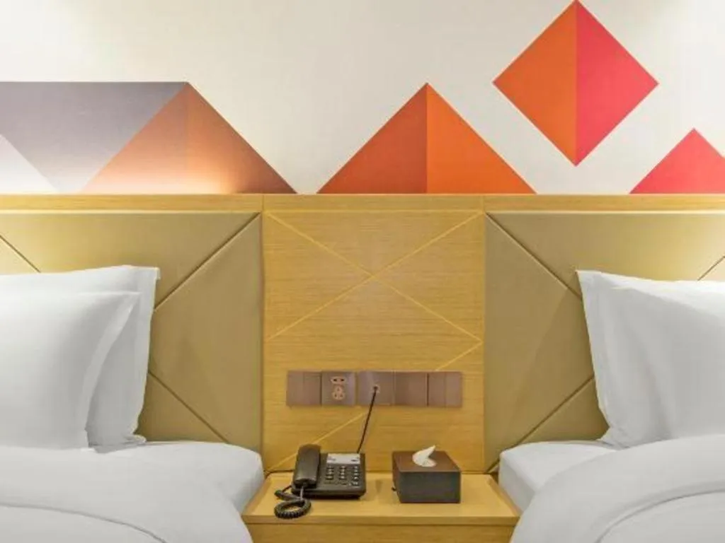 Bed in Borrman Hotel Zhuhai Gongbei Port Fuhuali Light Rail