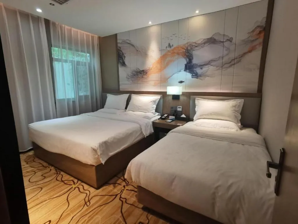 Bed in ZMAX Hotel Beijing Tongzhou Universal Tourist Resort Linheli Metro Station