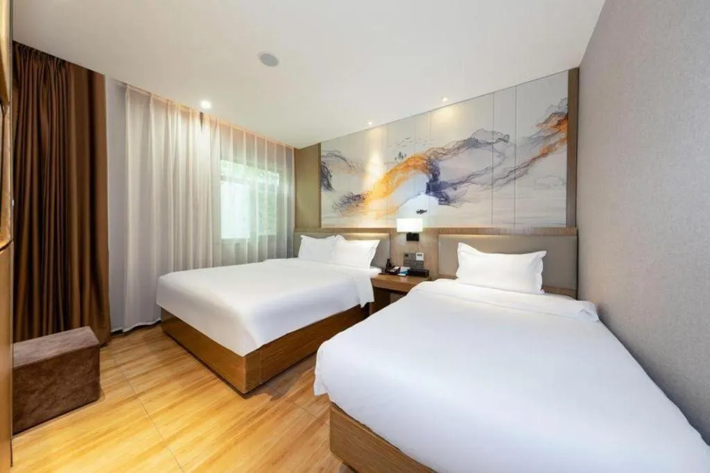 Bed in ZMAX Hotel Beijing Tongzhou Universal Tourist Resort Linheli Metro Station