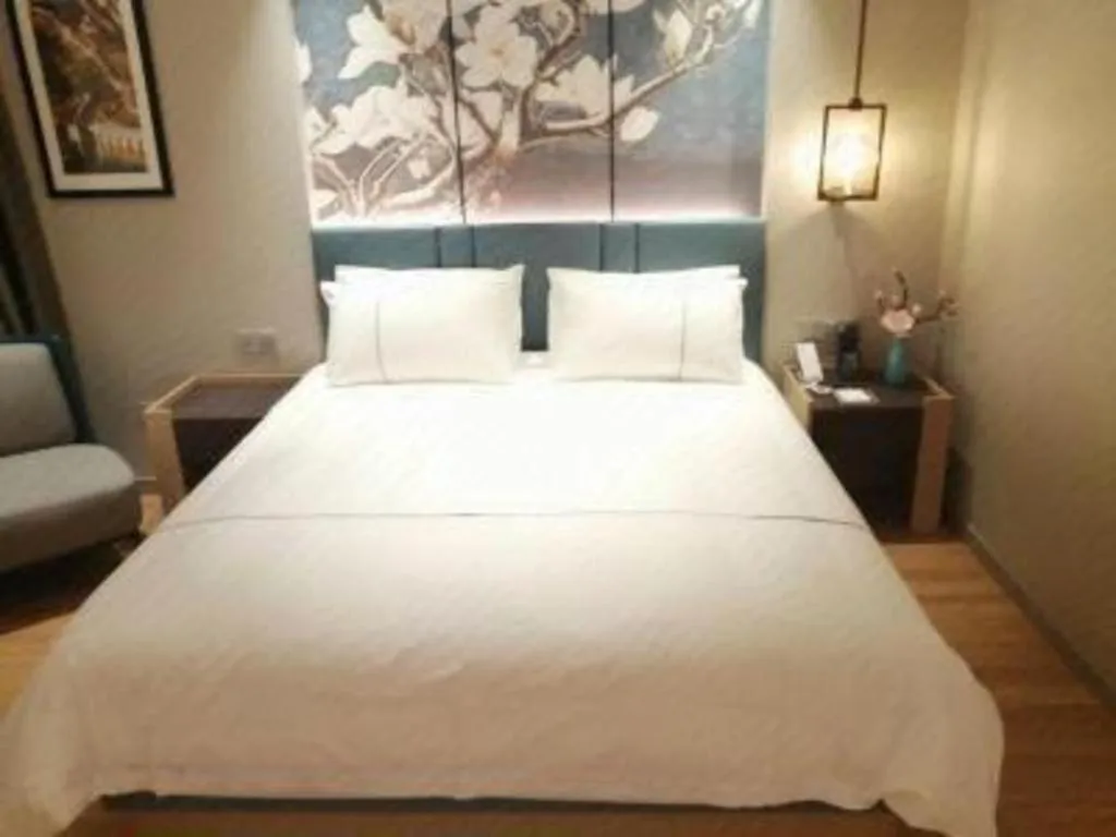 Bed in Magnotel Huludao Xingcheng Central Square Wenquan Street