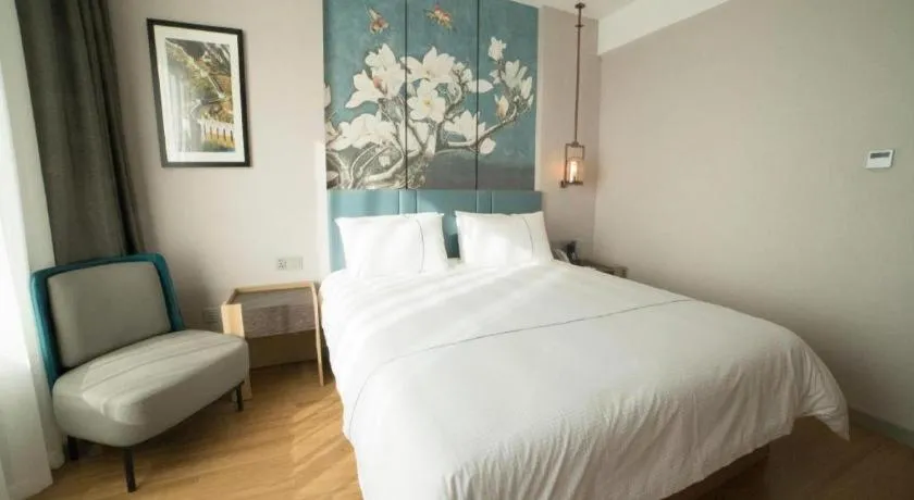 Bed in Magnotel Huludao Xingcheng Central Square Wenquan Street
