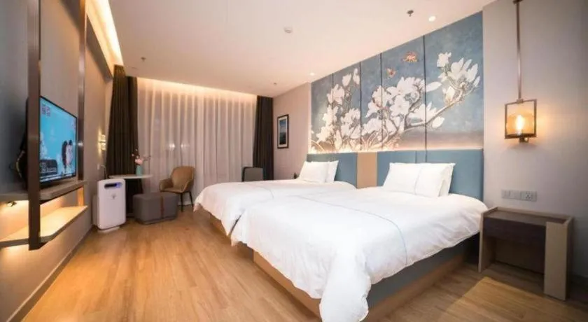 Bed in Magnotel Huludao Xingcheng Central Square Wenquan Street