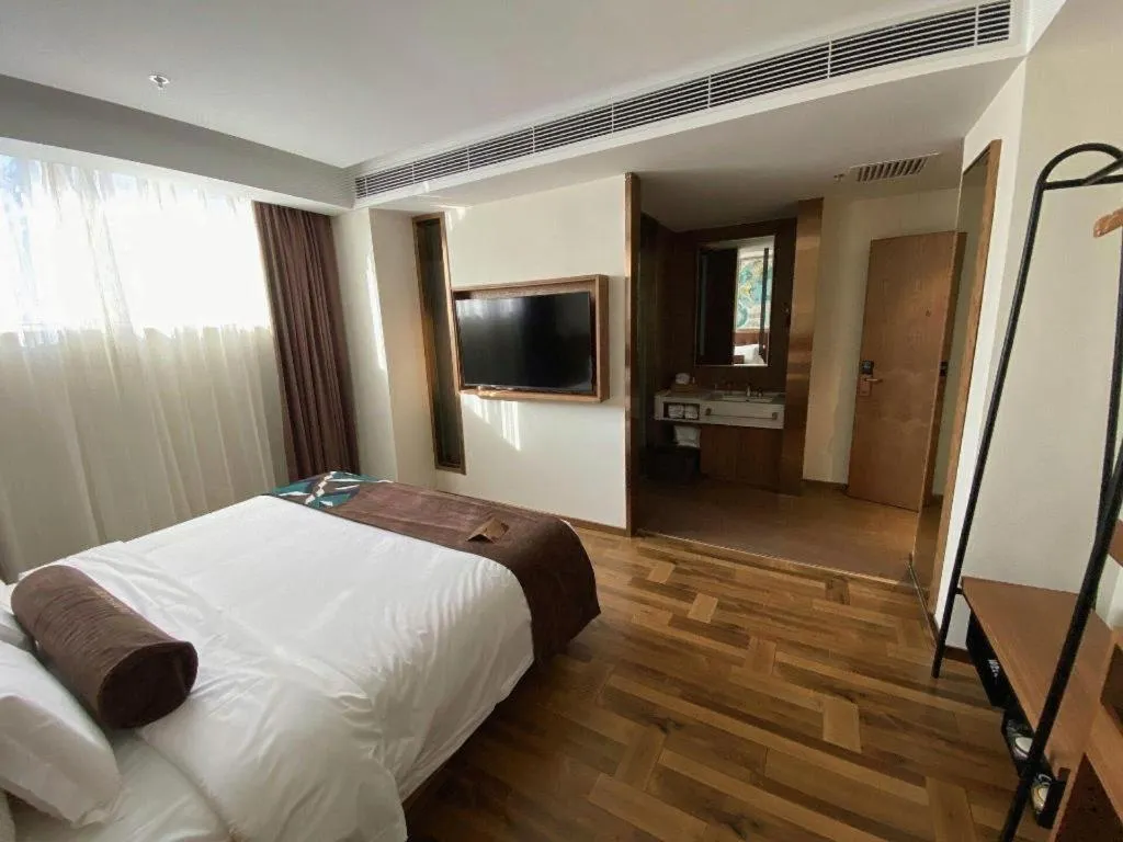 Bed in James Joyce Coffetel Shenyang North Railway Station Qishan Road Metro Station