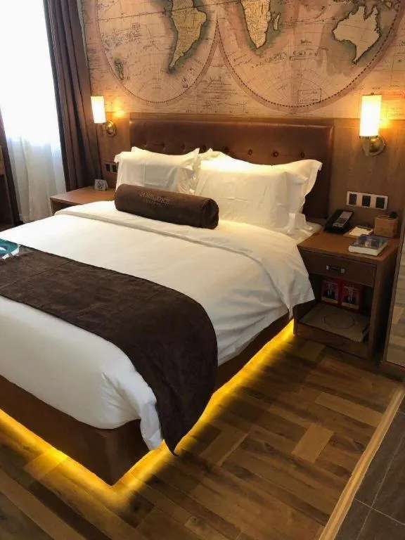 Bed in James Joyce Coffetel Shenyang North Railway Station Qishan Road Metro Station