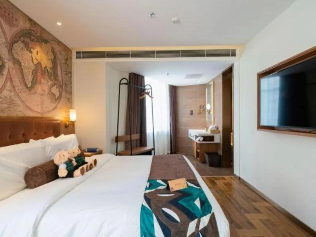 Bed in James Joyce Coffetel Shenyang North Railway Station Qishan Road Metro Station