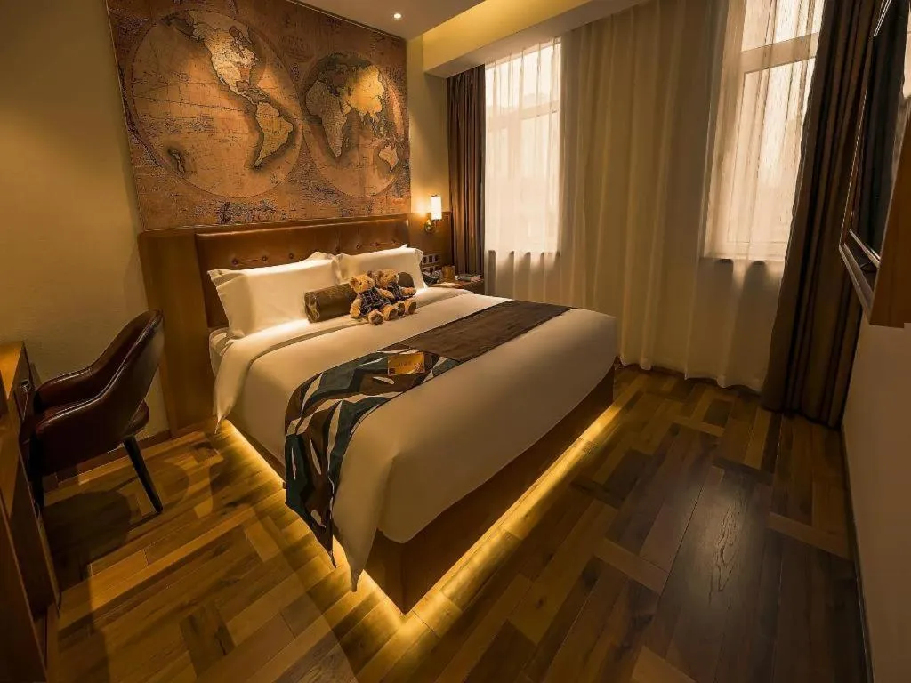 Bed in James Joyce Coffetel Shenyang North Railway Station Qishan Road Metro Station