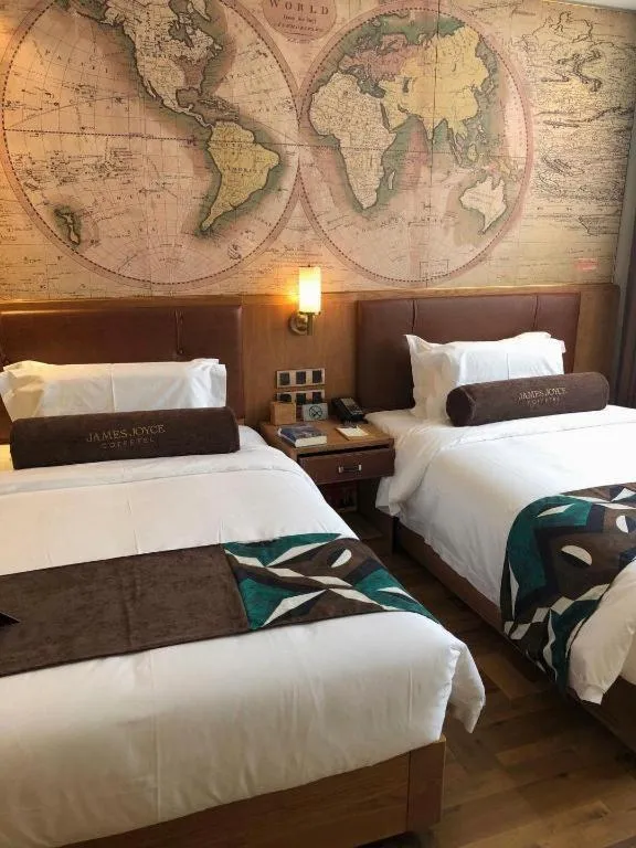 Bed in James Joyce Coffetel Shenyang North Railway Station Qishan Road Metro Station