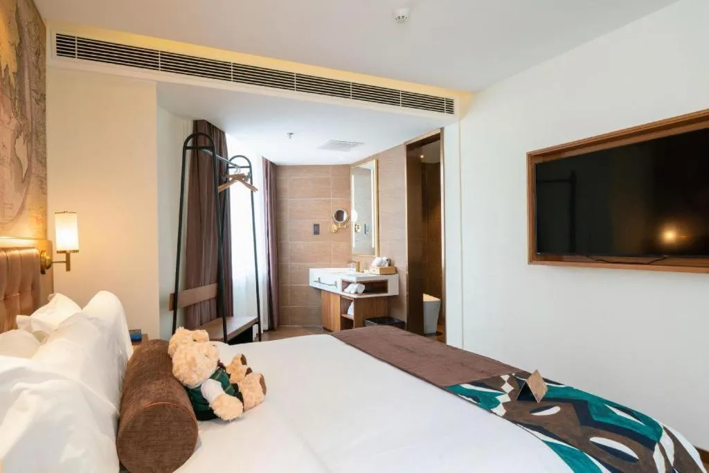 Bed in James Joyce Coffetel Shenyang North Railway Station Qishan Road Metro Station